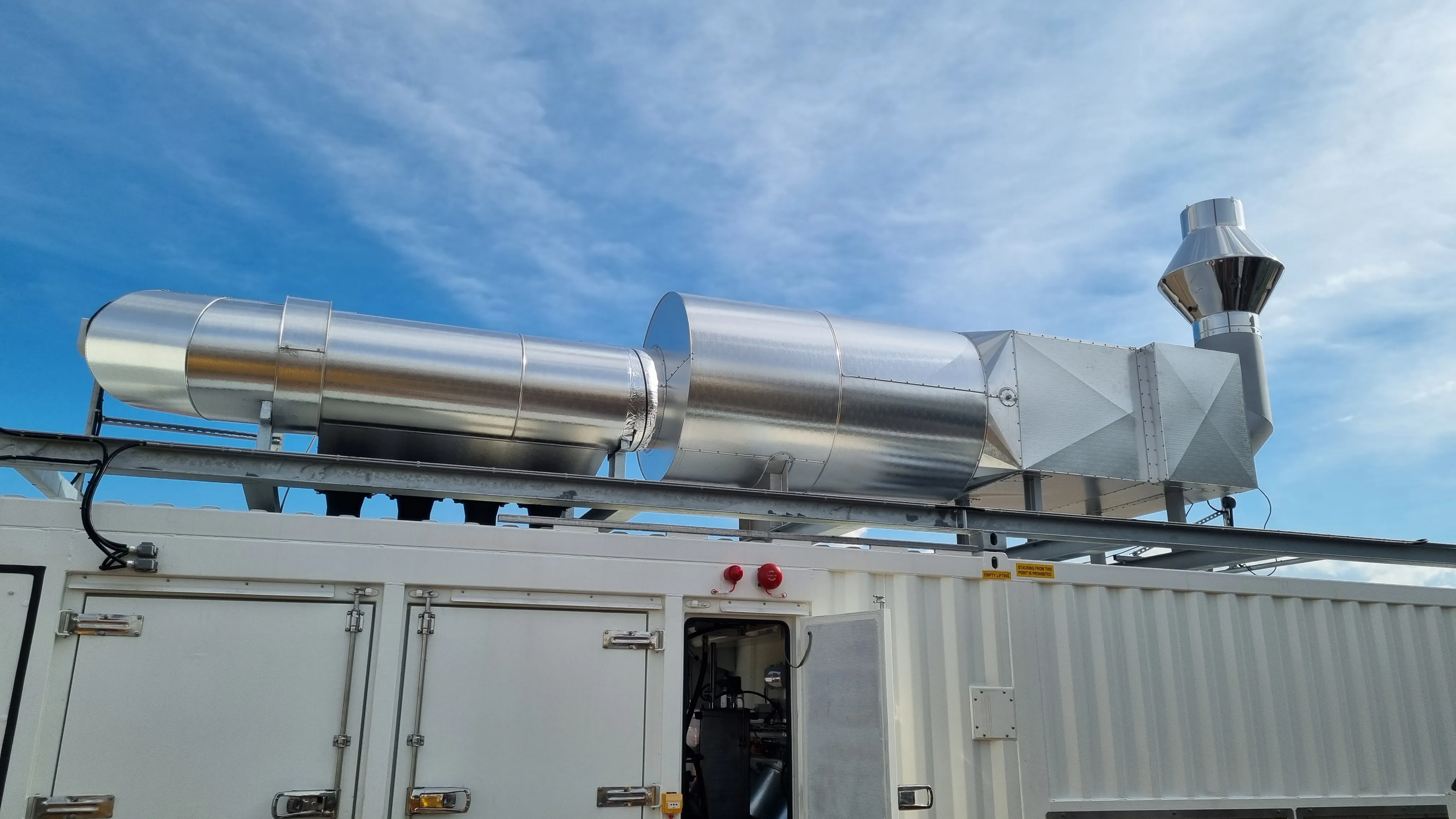 Axces integrated industrial exhaust system combining noise control, emission reduction and pressure management